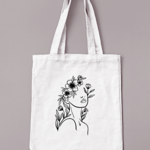 Sac réutilisable de couleur crème avec le buste d'une femme avec les cheveux fleuris en noir